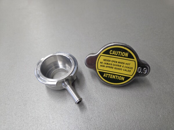 Radiator cap Japan model - 0,9 bar / 31 mm inclusive weld neck.